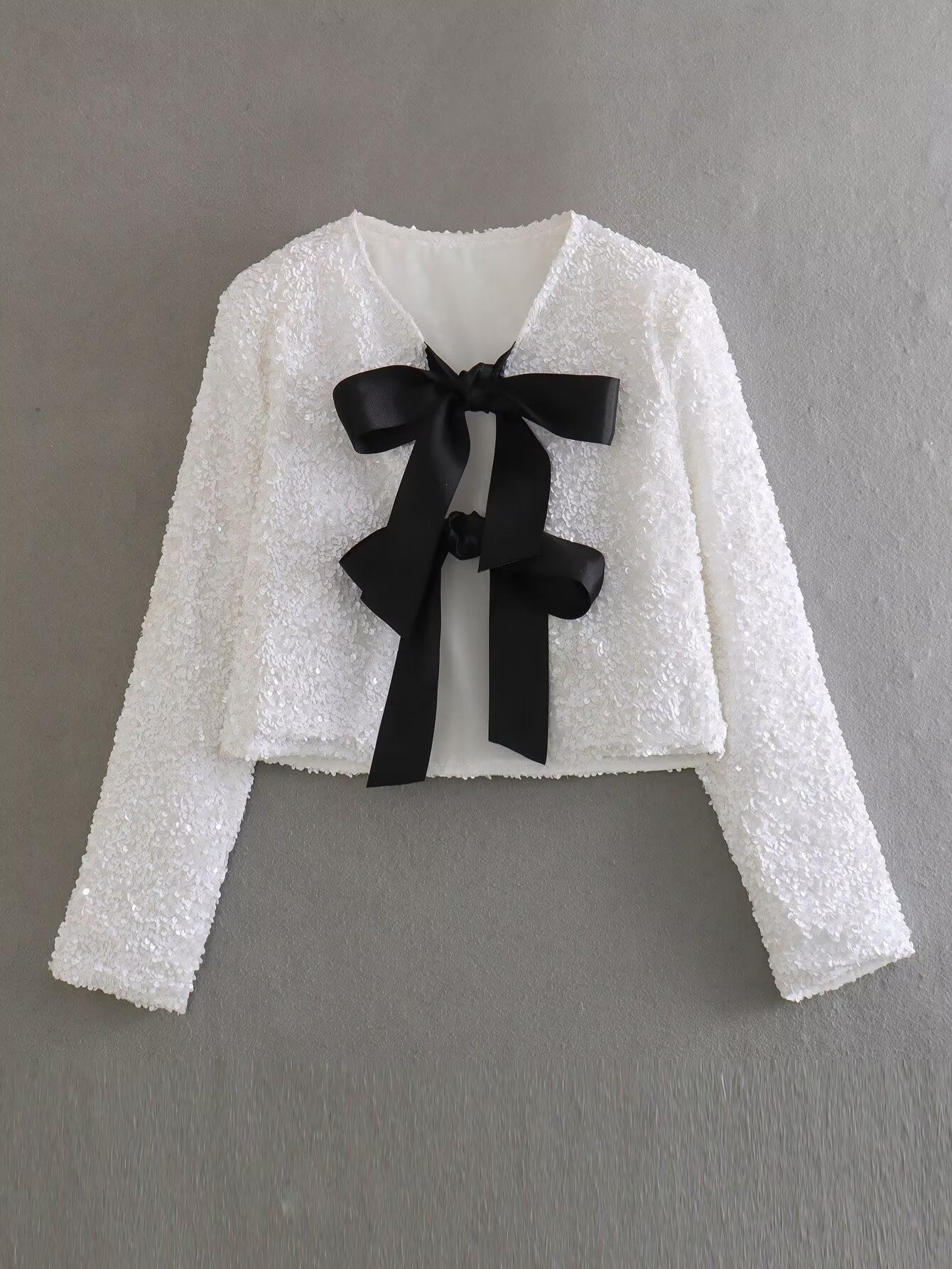 CHAQUETA LENTEJUELAS CON LAZO